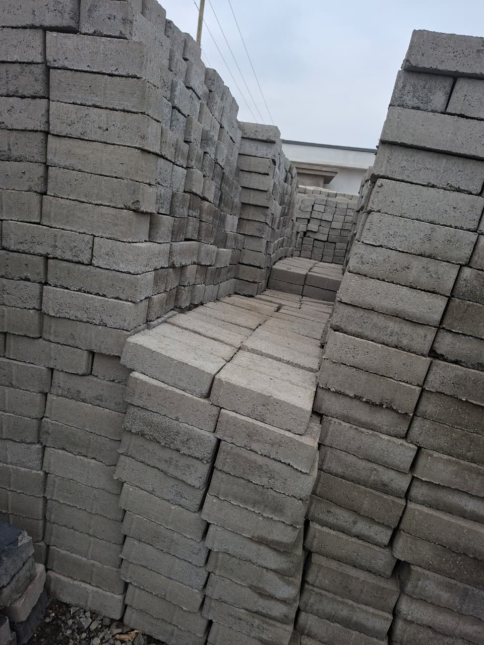 Natural grey rectangular cabro pavers produced in volume for clean, versatile paving layouts