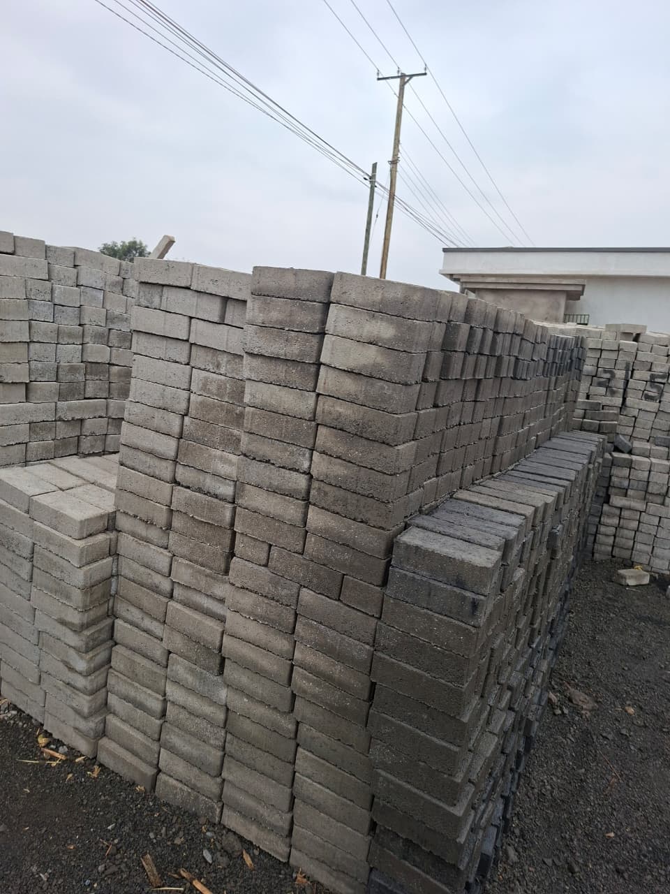 Natural grey rectangular cabro pavers produced in volume for clean, versatile paving layouts