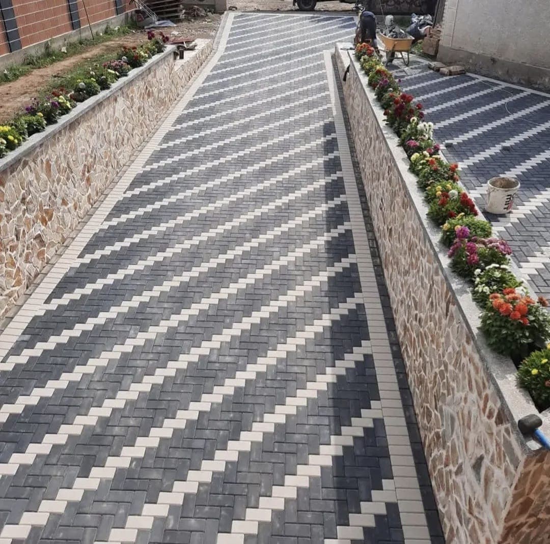 Completed black and white herringbone cabro driveway