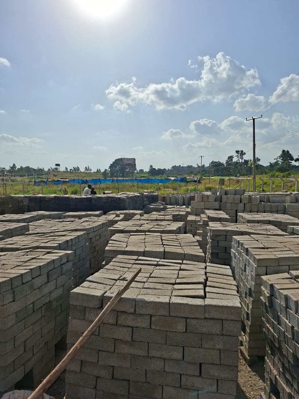Solid concrete blocks palletised for organised project supply.