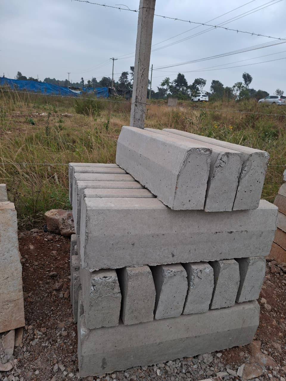 Precast invert drainage channels stocked for efficient stormwater control and rapid site installation
