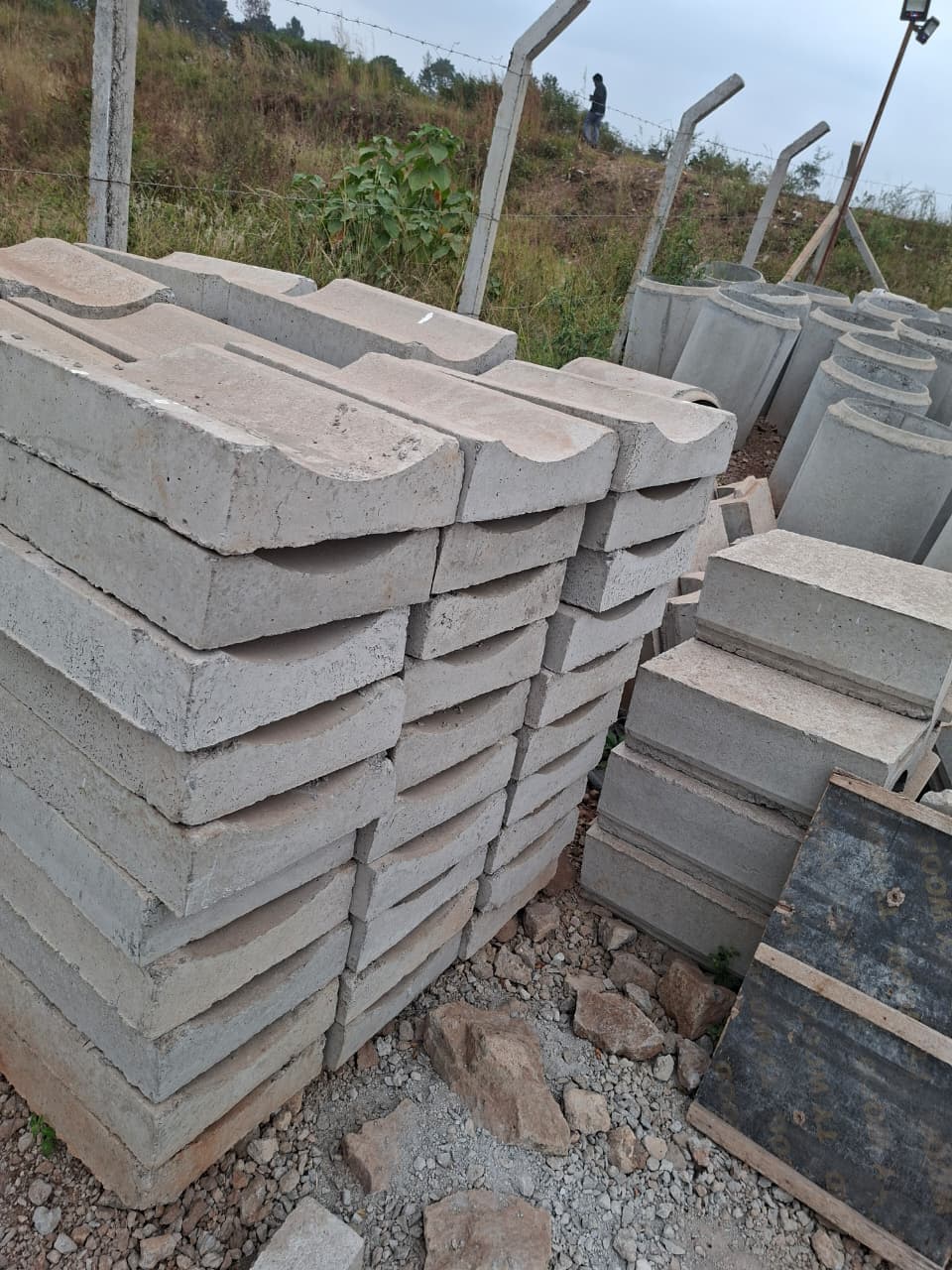 Precast invert drainage channels stocked for efficient stormwater control and rapid site installation