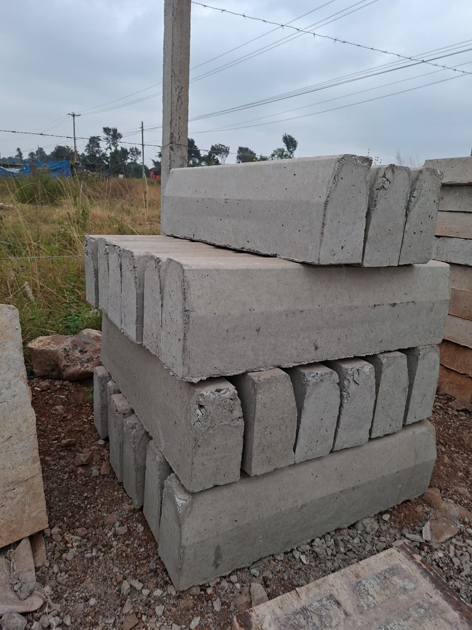 Precast invert drainage channels stocked for efficient stormwater control and rapid site installation