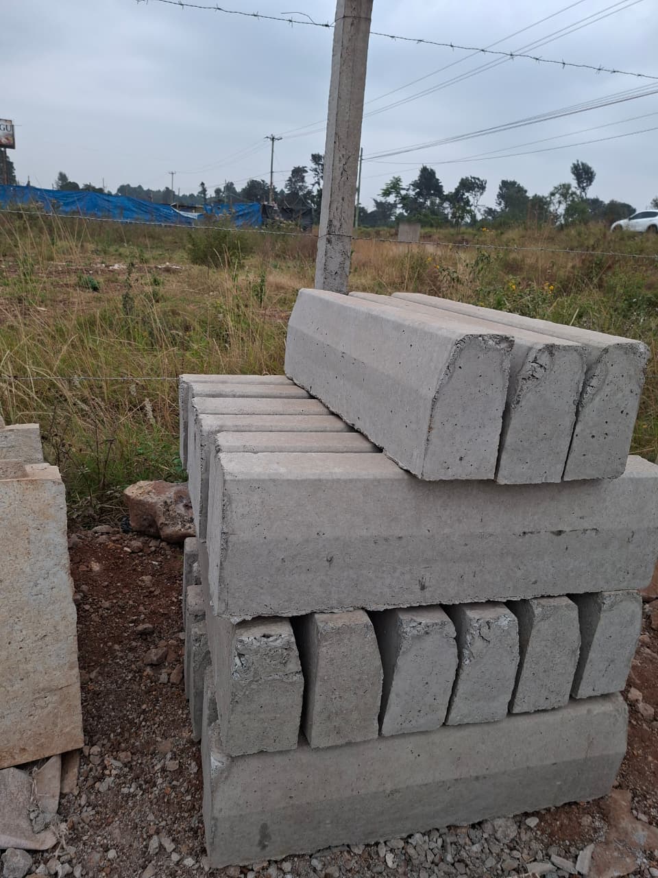 Precast invert drainage channels stocked for efficient stormwater control and rapid site installation