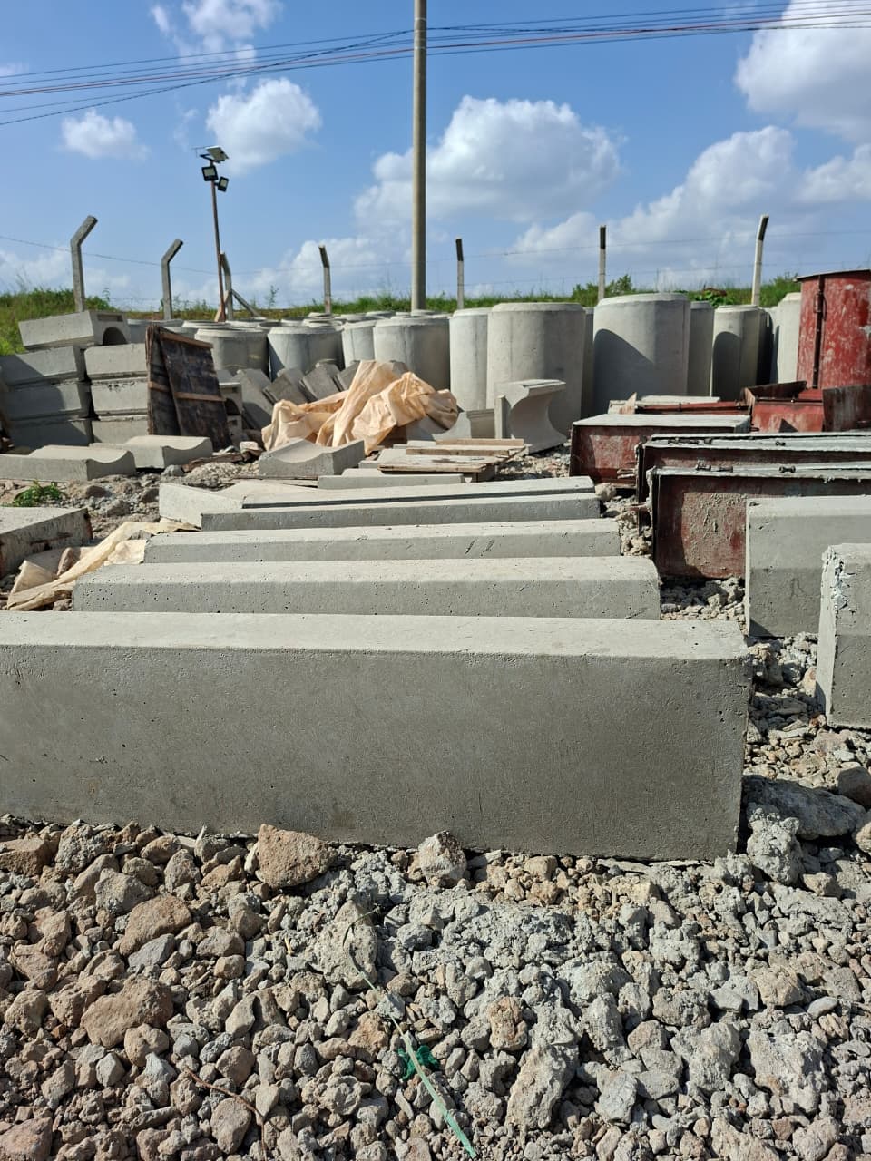 Rows of freshly cast kerbstones curing at the production yard