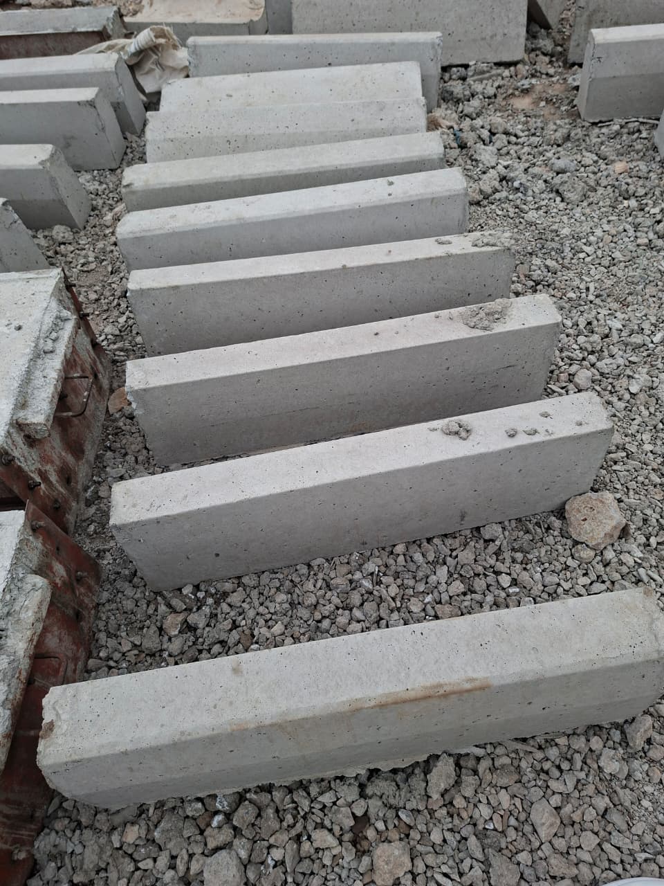 Straight precast kerbstones ready for neat, durable road and driveway edging